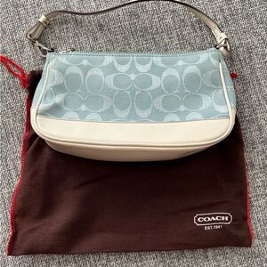 small light blue coach purse with white leather bottom